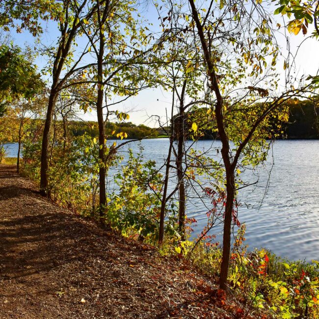 A natural path along Cedar Creek's lake draws walkers out to enjoy the seasons. Photo by Kinfolk Creative.