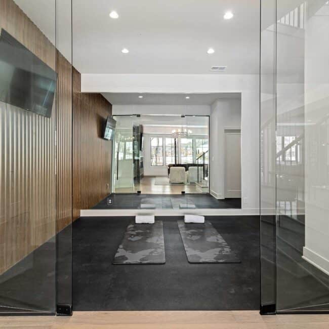 Other amenities in the space include a yoga/workout room, bar and wine storage, and a media room with an easy-on fireplace.