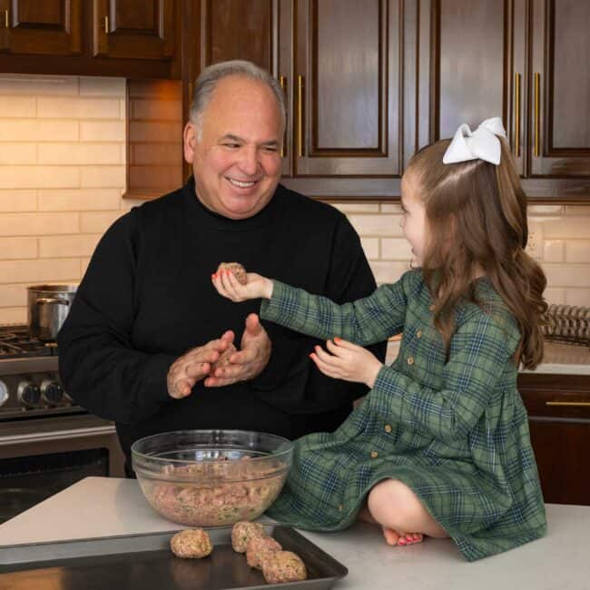 Chef Jasper Mirabile gets a welcome assist from granddaughter Sutton Pearl.