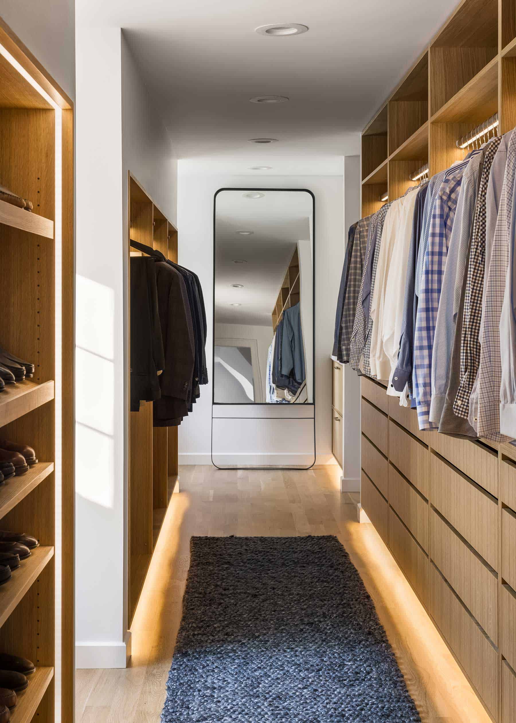 Successful closet design requires correct programming that also maximizes storage. “The closet rods feature integrated lighting, and recessed LED lighting was routed into each cabinet along with the toe kicks to create a clean, high-end finish and subtle ambient lighting throughout the space,” Faust says.