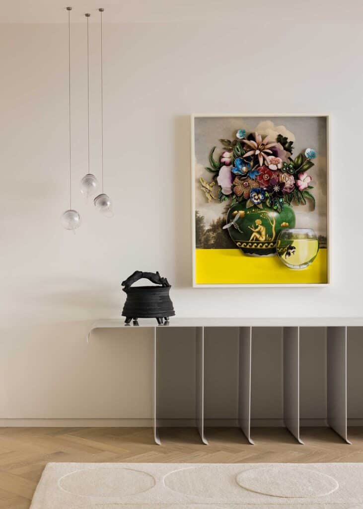The entrance’s major focal point is a striking vignette with a Ken Ferguson classic Hare ceramic, next to a multimedia framed work by Ron Norsworthy, procured from Edwynn Houk Gallery, NYC. The blown-glass pendant lights are by Bocci, sourced through Museo. Iman designed the console table, fabricated by Gieske Metal.