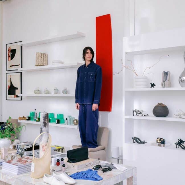 On Austin, a blue shirt and pants by Studio Nicholson.