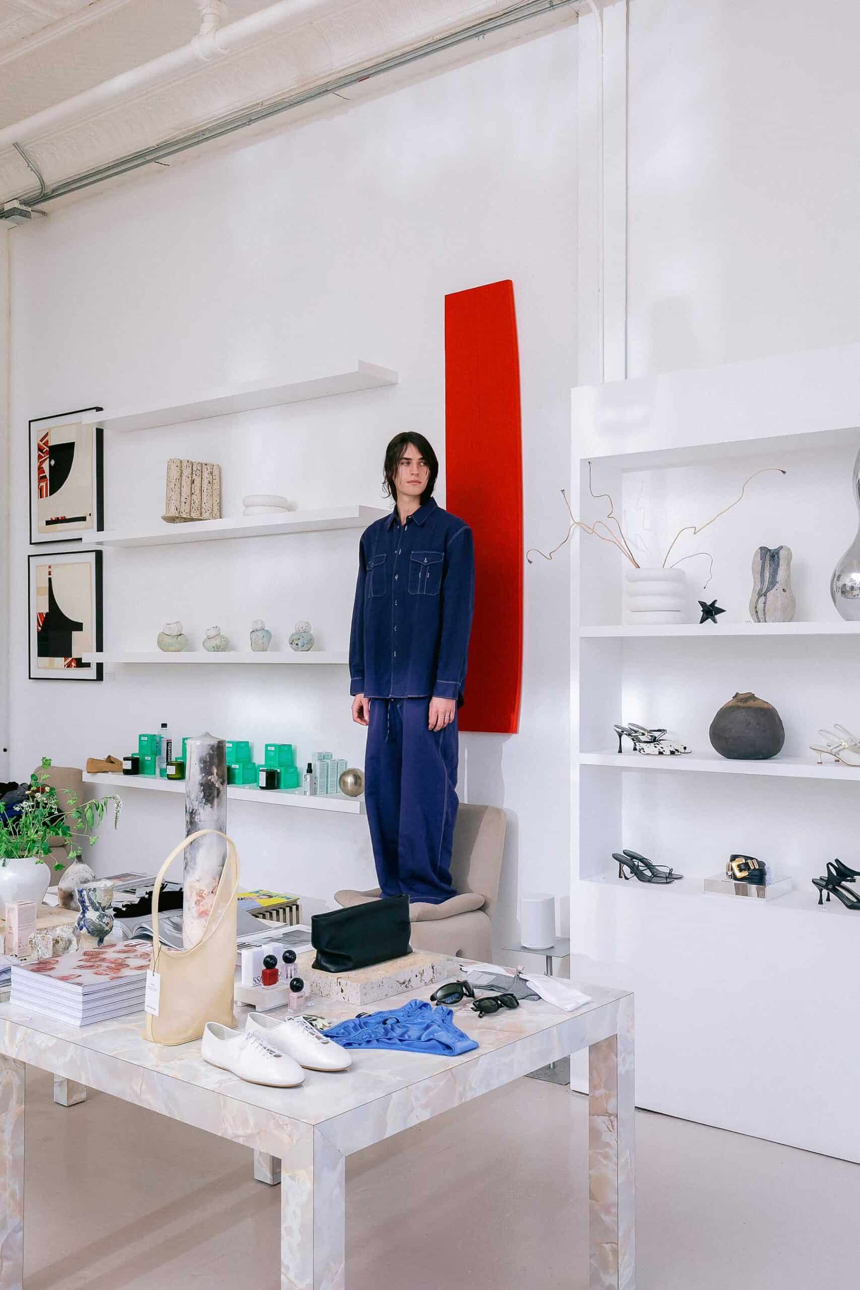 On Austin, a blue shirt and pants by Studio Nicholson.
