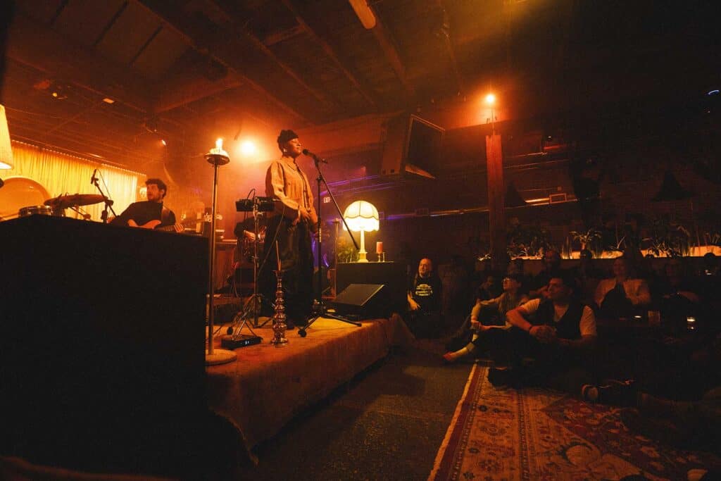 On the ITLF stage, Hailes met people’s eyes, introduced herself, and moved through the space as both headliner and someone sharing in the music. Designed to “erase that barrier and really make it a communal experience,” Living Room fostered a symbiotic exchange in which “the audience also has to make space for the performer.”